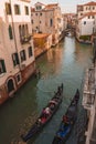 Iconic Gondolas on Moving Canal in Venice, Italy - Classic Venetian Scene