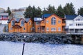 Iconic houses surround the bay in ELIASSEN RORBUER in Lofoten