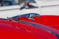 Iconic Jaguar symbol Leaping Jaguar on the bonnet of a vintage classic Jaguar sports car