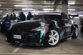 Iconic Japanese racing car, the black Nissan 350Z tuned by HKS parked in a parking lot