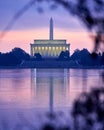 Iconic Landmark Washington Monument and Lincoln Memorial at sunrise with reflection in water Royalty Free Stock Photo