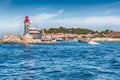 Iconic lighthouse in the harbor of Saint-Tropez, Cote d`Azur, France Royalty Free Stock Photo