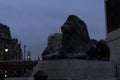 Iconic Lion Statue from Trafalgar Square with Big Ben in the Background during on overcast morning concept for Visual Journey of Royalty Free Stock Photo
