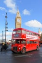 Iconic London red double decker routemaster bus in front of Big Ben Royalty Free Stock Photo