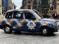 Iconic London taxi on the streets of Scotland capital city Edinburgh Royalty Free Stock Photo