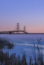 Iconic Mackinac bridge in frozen Lake Michigan under twilight Royalty Free Stock Photo