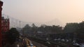 Morning view of Kolkata with iconic Howrah bridge and yellow ambassador taxi Royalty Free Stock Photo