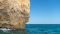 The iconic natural rock formation called The face in Praia da Marinha in Algarve, Portugal Royalty Free Stock Photo