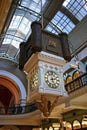 Decorative hanging Royal Clock in historic shopping arcade of Queen Victoria Building QVB in Sydney CBD, Australia