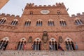 The iconic Palazzo Pubblico at the Piazza del Campo in downtown Siena Royalty Free Stock Photo
