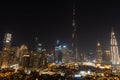 Iconic panorama at night of Burj Khalifa and Dubai Skyline with beautiful night colors on other skyscrapers in the Middle East