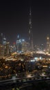 Iconic panorama at night of Burj Khalifa and Dubai Skyline with beautiful night colors on other skyscrapers in the Middle East