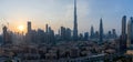 Iconic panorama at sunset of Burj Khalifa and Dubai Skyline as sun sets with and other skyscrapers in the Middle East with blue