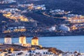 Iconic picture of Mykonos. Famous windmills of Mykonos Island, Greece. Sunset time Royalty Free Stock Photo