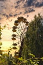 Iconic pripyat ferris wheel in the exclusion zone on a golden red sunset in the summer. Red almost burning sky indicating recent Royalty Free Stock Photo