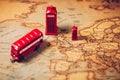 The iconic red bus and Big Ben miniature with compass on the map Royalty Free Stock Photo