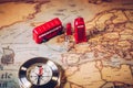 The iconic red bus and Big Ben miniature with compass on the map Royalty Free Stock Photo