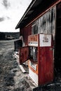 Iconic red Coca-Cola vending machine in front of a vintage, weathered building