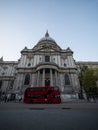 Iconic red double-decker bus in front of famous landmark St Pauls Cathedral church in London England Great Britain UK Royalty Free Stock Photo