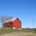 Iconic gable roof red wood barn in the FingerLakes NYS Royalty Free Stock Photo