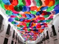 Iconic roof made with multicolored umbrellas from the Linares passage, located between Universidad Avenue and El Venezolano Square