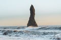 Iconic seastack in front of the world-famous Reynisfjara Black sand beach in Reynisdrangar, Iceland