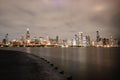 Iconic skyline of Chicago illuminated by the night sky, showcasing the city's dazzling lights