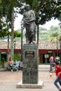 Iconic statue of Simon Bolivar in Plaza Bolivar in El Hatillo and people, children,women and men spending time playing and resting Royalty Free Stock Photo