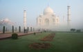 Iconic Taj Mahal, the white marble mausoleum located in Agra, India, shrouded in a thick fog