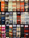 Iconic tartan scarves on sale in Scotland capital Edinburgh with many patterns Royalty Free Stock Photo