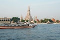 Temple of Dawn or Wat Arun with the Famous Chao Phraya River Water Bus in Foreground, Bangkok, Thailand