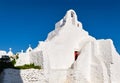 Iconic tourist landmark, Mykonos, Greece. White Greek Orthodox church of Panagia Paraportiani, town of Chora on island Royalty Free Stock Photo