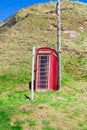 Traditional old British Telecom red phone box in Crovie, Aberdeenshire, Scotland Royalty Free Stock Photo