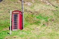 Traditional old British Telecom red phone box in Crovie, Aberdeenshire, Scotland Royalty Free Stock Photo