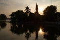 Tran Quoc Pagoda reflecting in lake, Hanoi, Vietnam at sunset