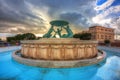 Iconic Triton fountain in front of the City Gate to Valletta, capital of Malta