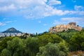 Iconic vew of Acropolis hill and Lycabettus hill in background in Athens, Greece from Pnyx hill in summer daylight with Royalty Free Stock Photo