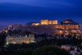 Iconic view of Acropolis hill in Athens, Greece at night. Delicate lights of Parthenon and Odeon theater. UNESCO world Royalty Free Stock Photo