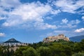 Iconic view of Acropolis hill and Lycabettus hill in background in Athens, Greece from Pnyx hill in summer daylight with Royalty Free Stock Photo