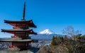 The iconic view of Mount Fuji with the red Chureito pagoda and Fujiyoshida city from Arakurayama sengen park in Yamanashi Royalty Free Stock Photo