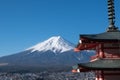 The iconic view of Mount Fuji with the red Chureito pagoda and Fujiyoshida city from Arakurayama sengen park in Yamanashi Royalty Free Stock Photo