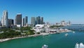 Iconic waterfront Bayview park with luxury high-raised architecture of Miami downtown on background. White yachts