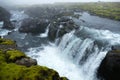 Icy blue waterfall in the fog on waterfall trail, stage one of FimmvÃÂ¶rduhals mountain pass, Iceland Royalty Free Stock Photo