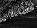 Icy branches above winter creek. Bright reflections in icicles, Royalty Free Stock Photo