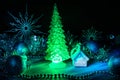 Icy Christmas tree glowing with red light on a blue background Royalty Free Stock Photo