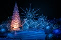 Icy Christmas tree glowing with yellow light on a blue background Royalty Free Stock Photo