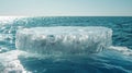 Icy Circular Platform Floating in Clear Blue Ocean Under Sunny Sky Royalty Free Stock Photo