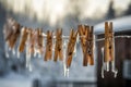 Icy clothespins hanging on line. Generate ai Royalty Free Stock Photo