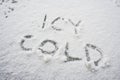 Icy cold written in white snow Royalty Free Stock Photo