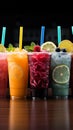 Icy fruit slushies stand united in plastic cups, forming a chilly lineup